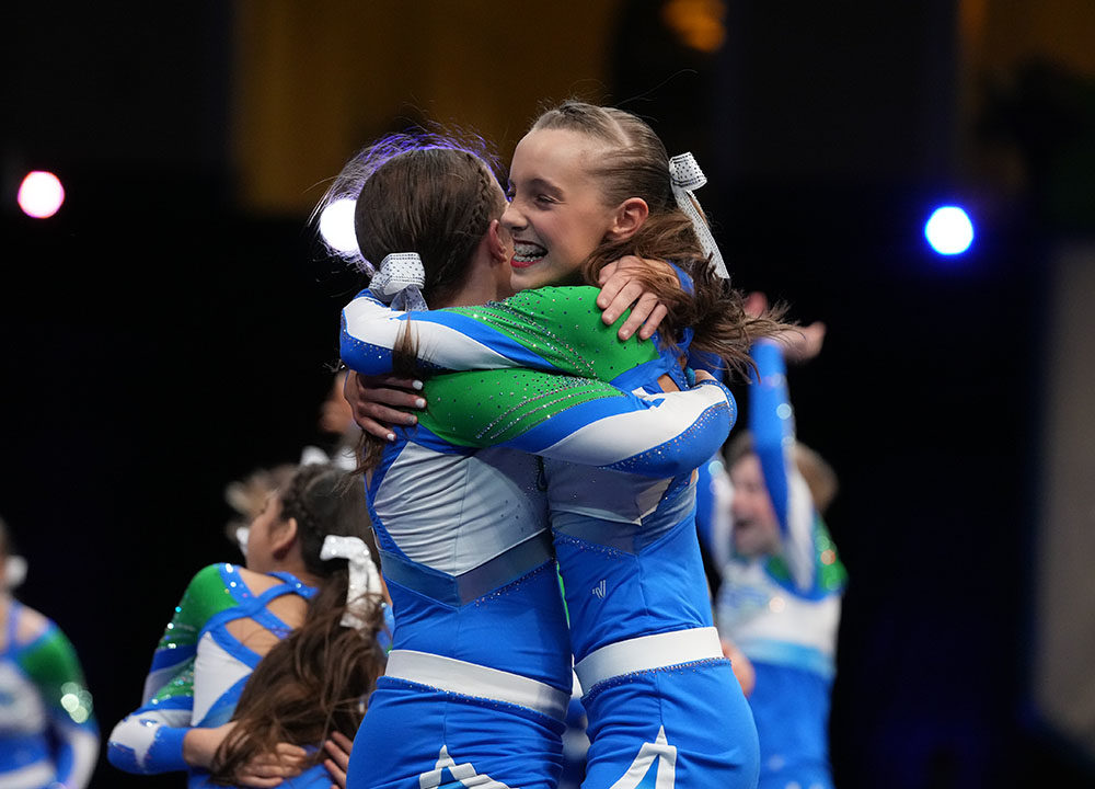 Cheerleaders from Stingrays hugging
